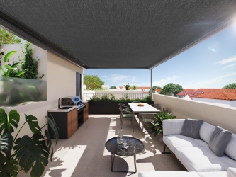 Private patio residence with expansive living spaces and rooftop solarium